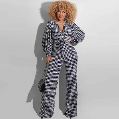 Blaze | Jumpsuit met V-hals, pofmouwen en rechte pijpen in houndstooth-patroon