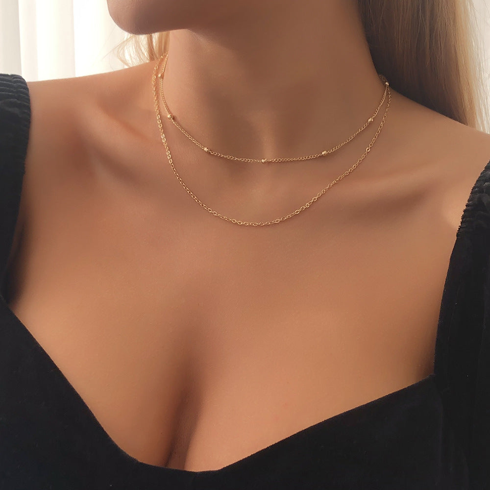 Minimalistische meerrijige ketting met ronde kralen